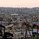 Pump jacks and wells are seen in an oil field on the Monterey Shale formation where gas and oil extraction using fracking near McKittrick, California.